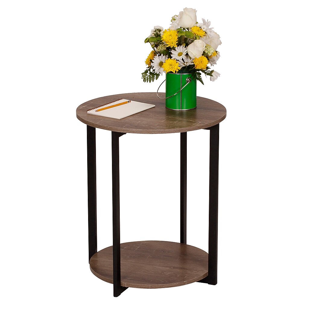 Round end table with vase of flowers on top