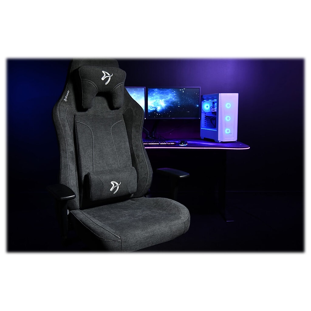 Arozzi Vernazza XL gaming chair in a dark setting with computer setup