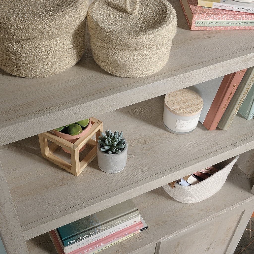 Close-up of shelf showing decorative items and wood finish