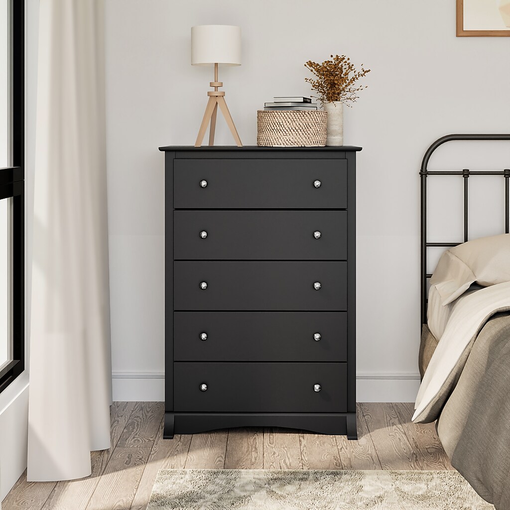 Bedroom with black chest next to bed