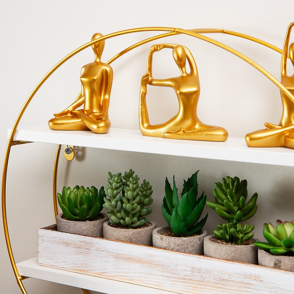 Top of shelf with gold figurines