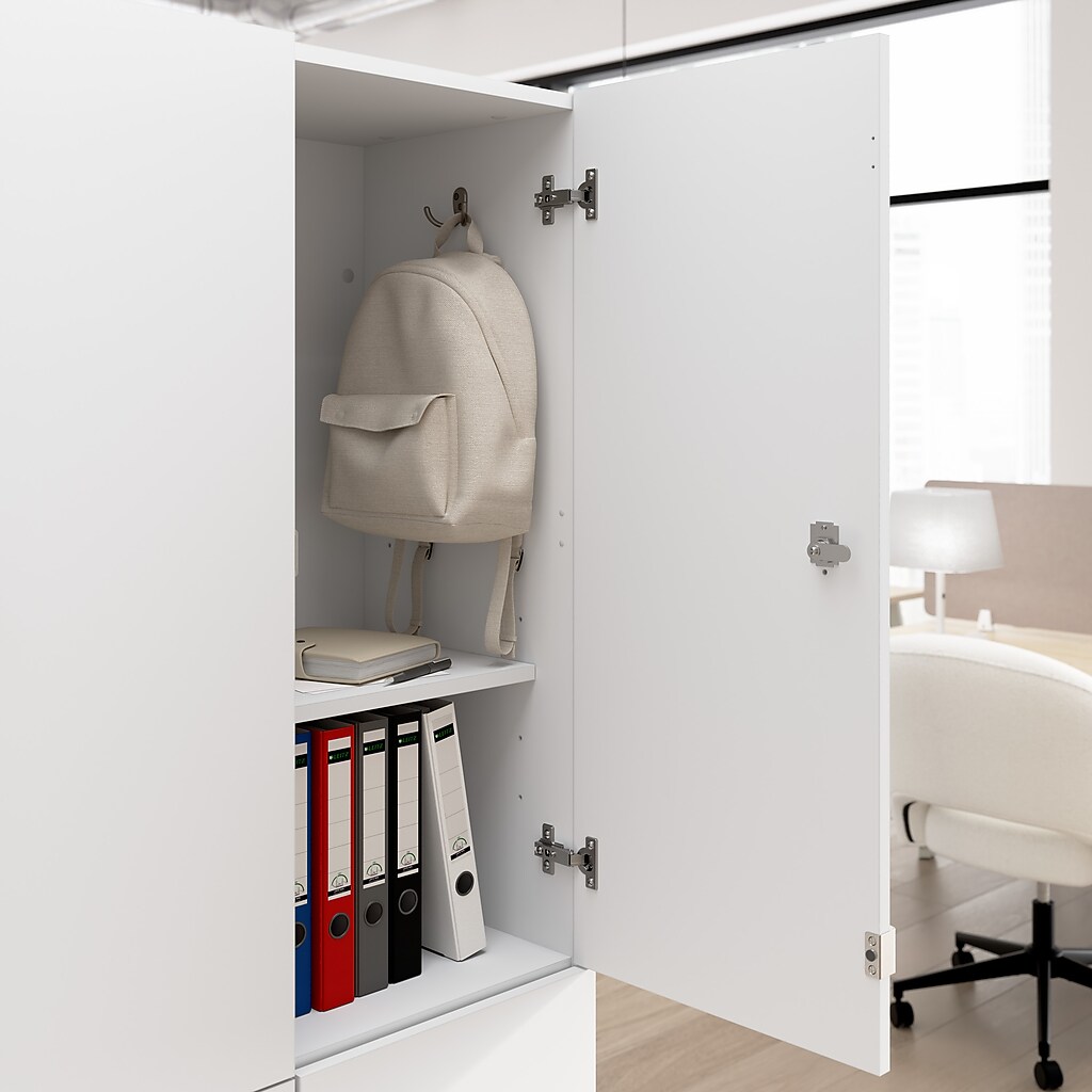 Open cabinet with interior storage showing backpack and binders