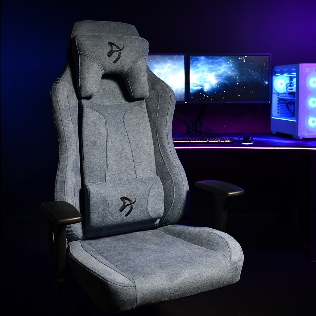 Arozzi Vernazza blue gaming chair in a dark purple-lit setup