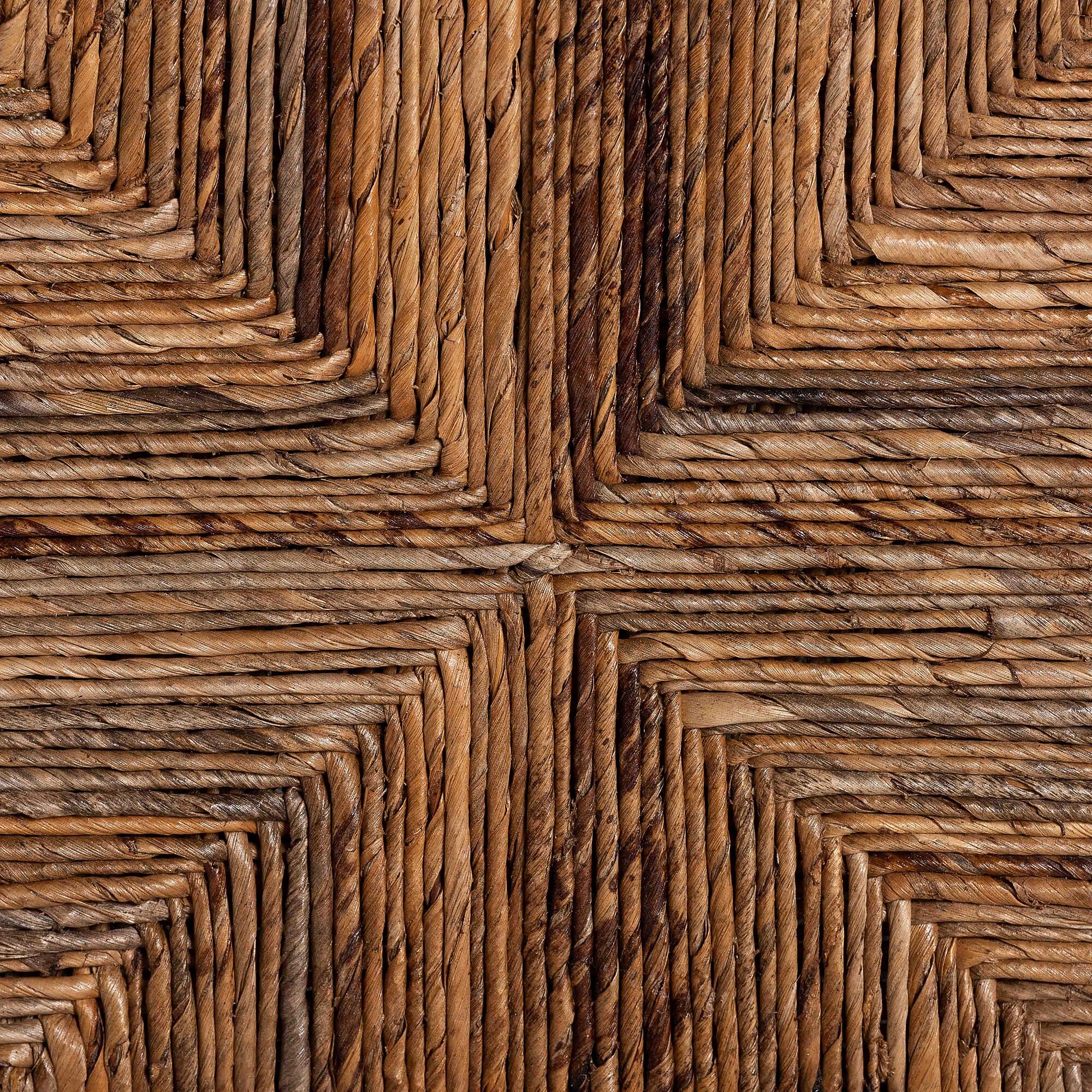 Close-up of natural seagrass woven pattern on dining chair back.
