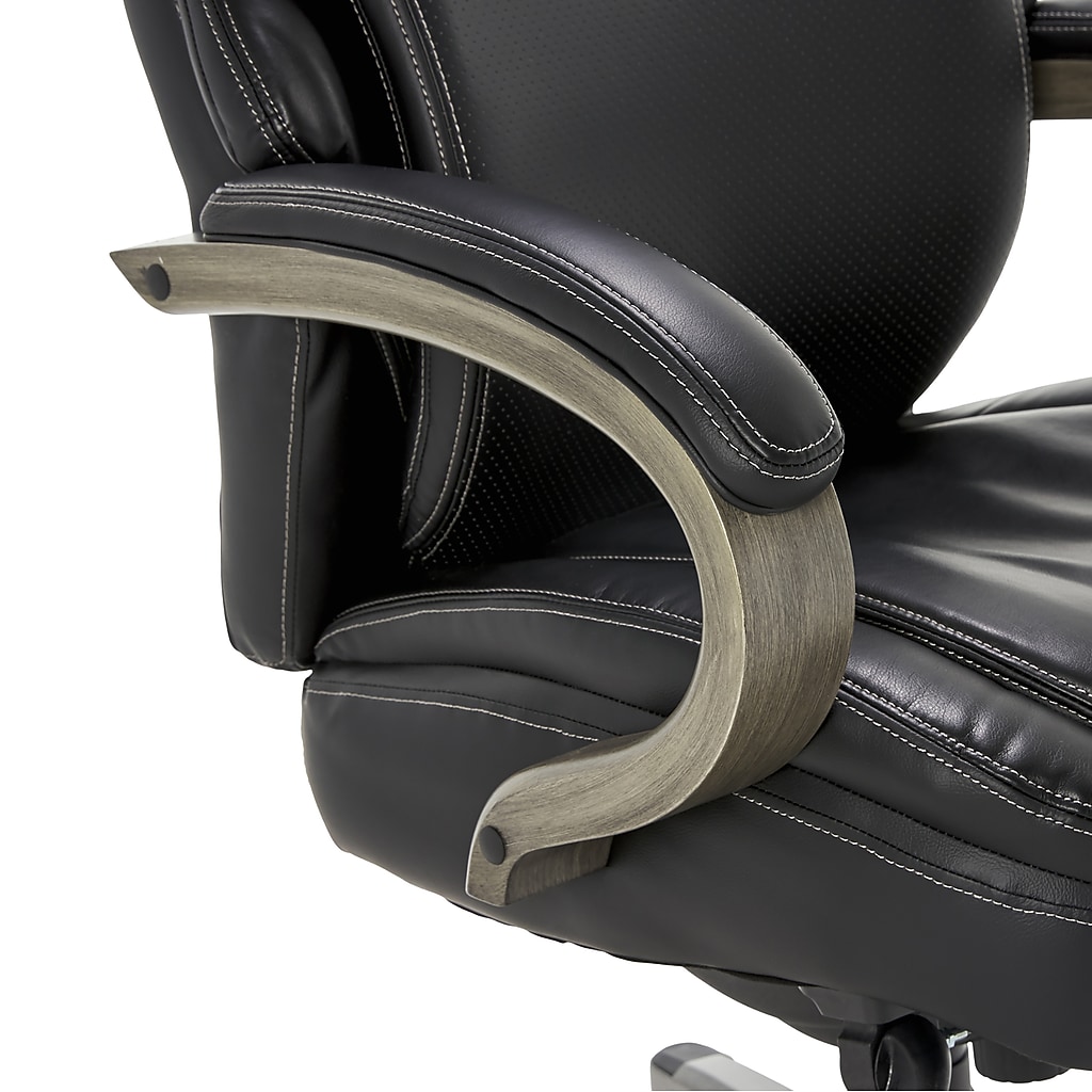 Close-up of armrest attachment and curved wood arm