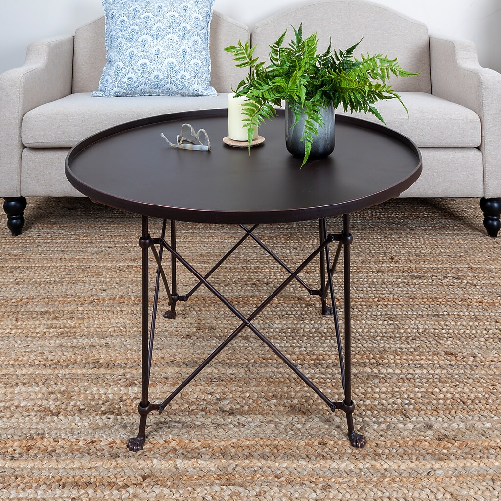 Round dark brown coffee table in living room setting