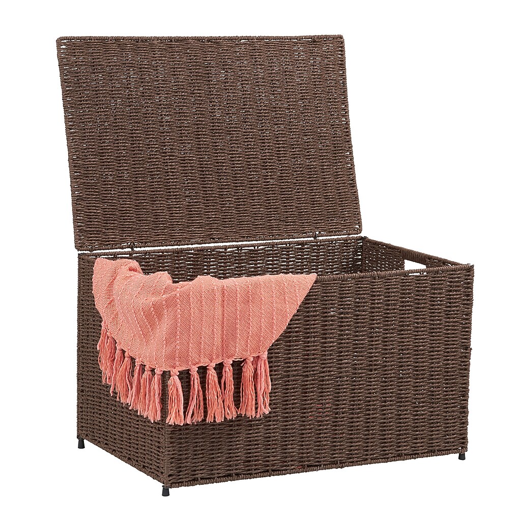 Open wicker storage chest with pink throw blanket