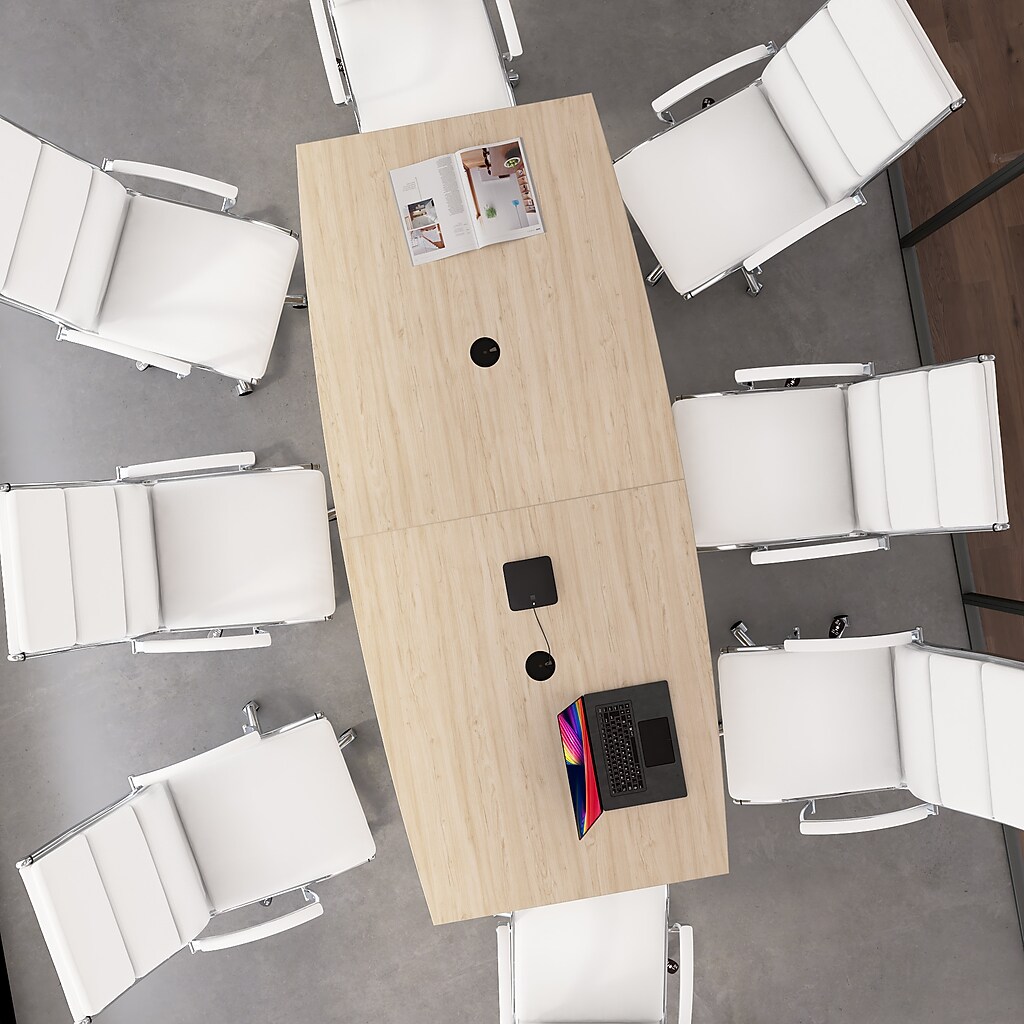 Top-down view of a large wooden conference table with six white chairs around it