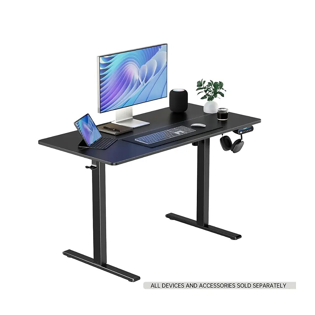 Desk setup with monitor, laptop, and accessories on Huanuo desk