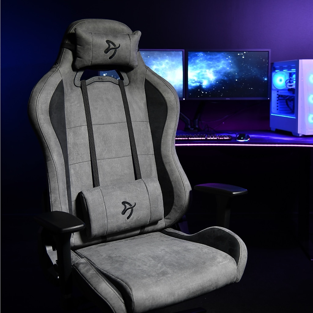 Arozzi Torretta gray gaming chair in a dark blue-lit room