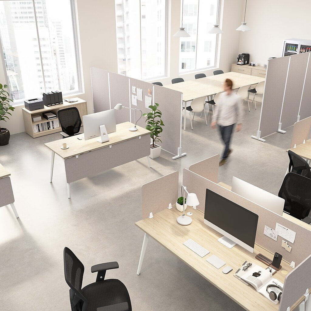 Open-plan office with multiple desks and dividers