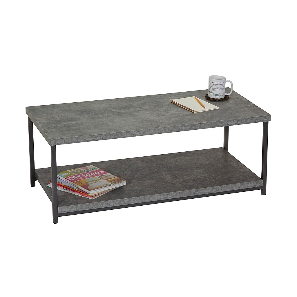 Coffee table with mug and notebook on top, lower shelf with magazines
