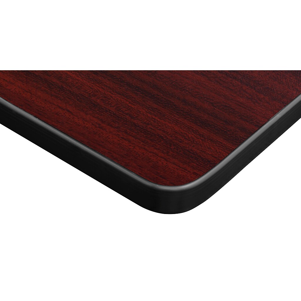 Close-up of table edge showing mahogany top and black edging