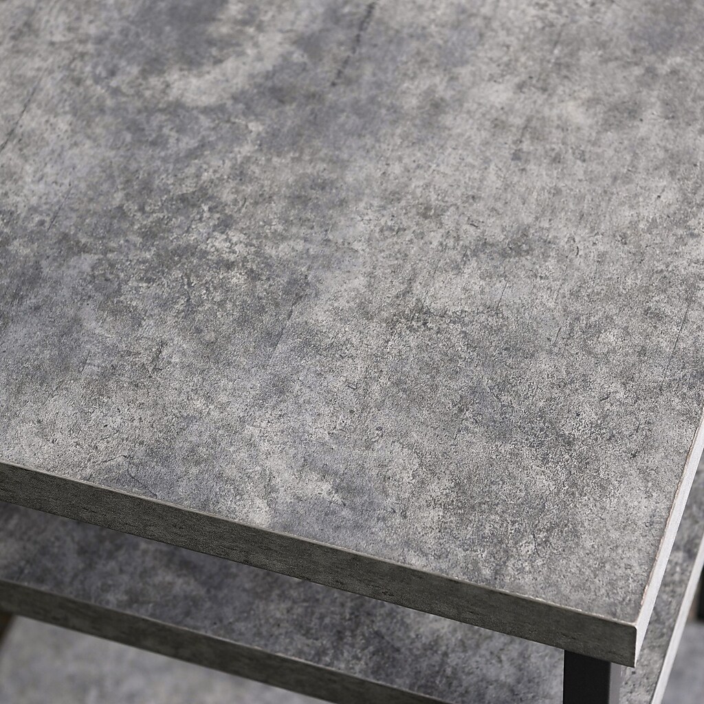 Close-up of the textured gray concrete tabletop