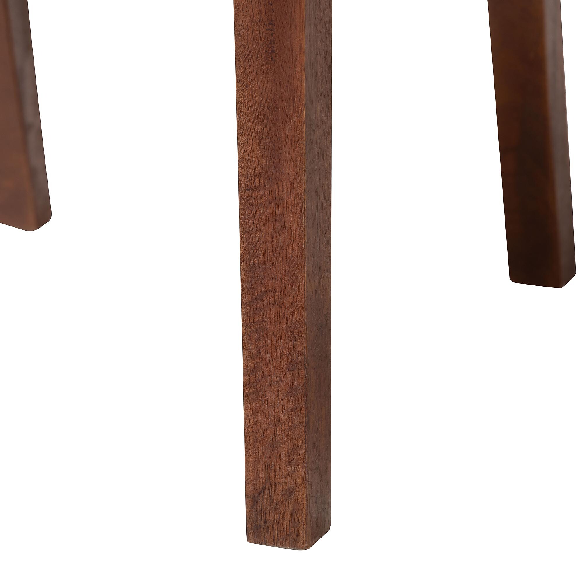 Close-up of teak dining chair leg with smooth stained finish.