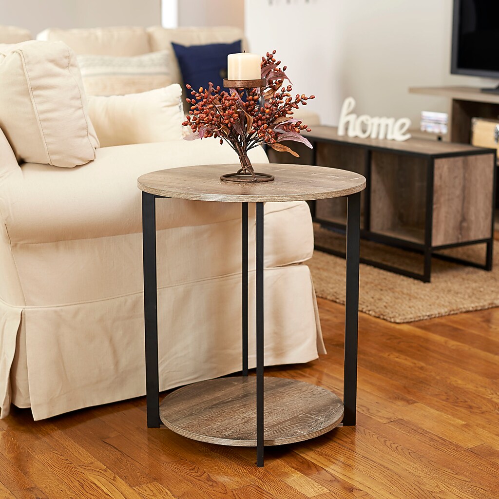 Round end table in living room with decor