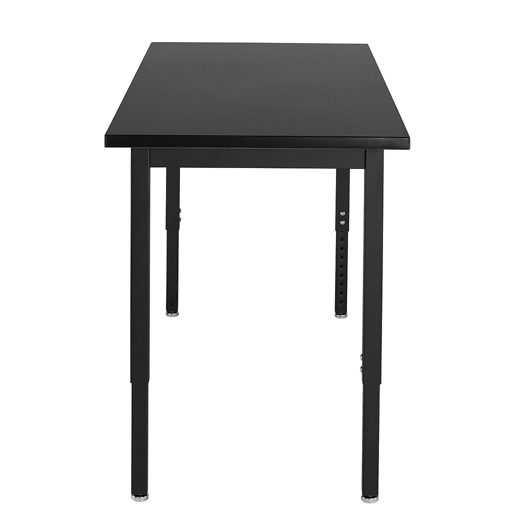 Close-up of corner/edge of black table top and leg