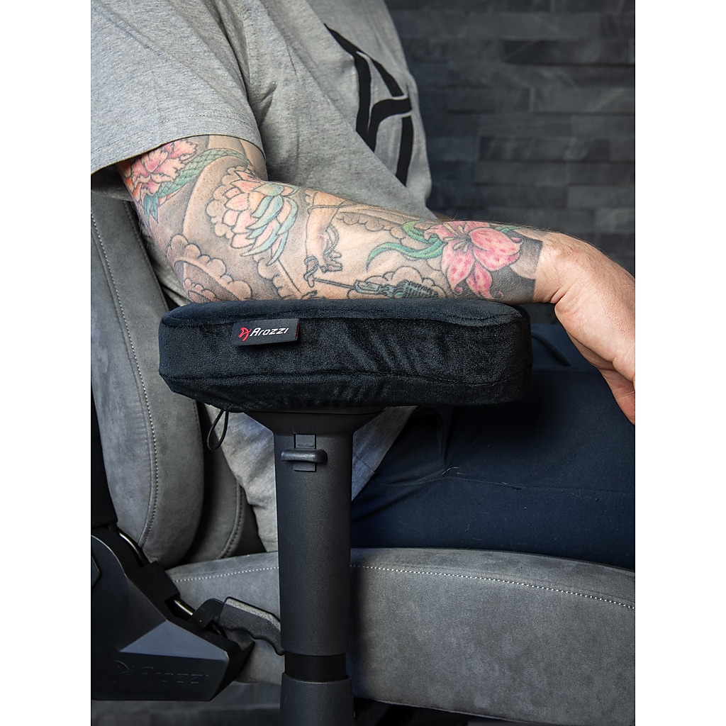 Person using chair with armrest pad on desk chair
