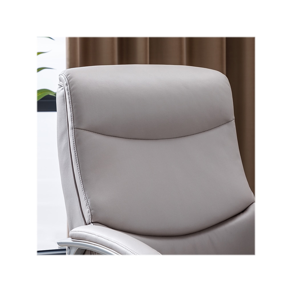 Close-up of chair back/seat edge showing upholstery