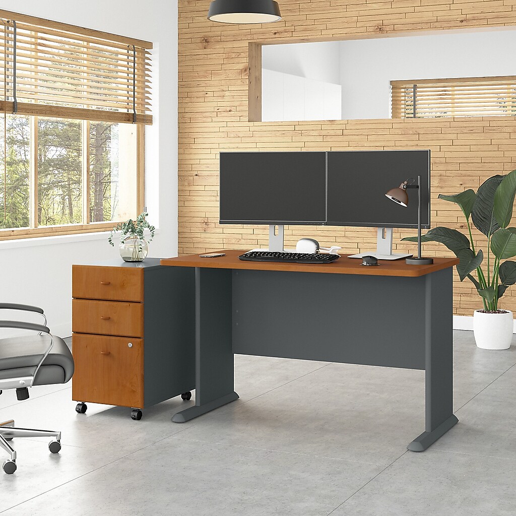 Desk with a mobile filing cabinet and monitor