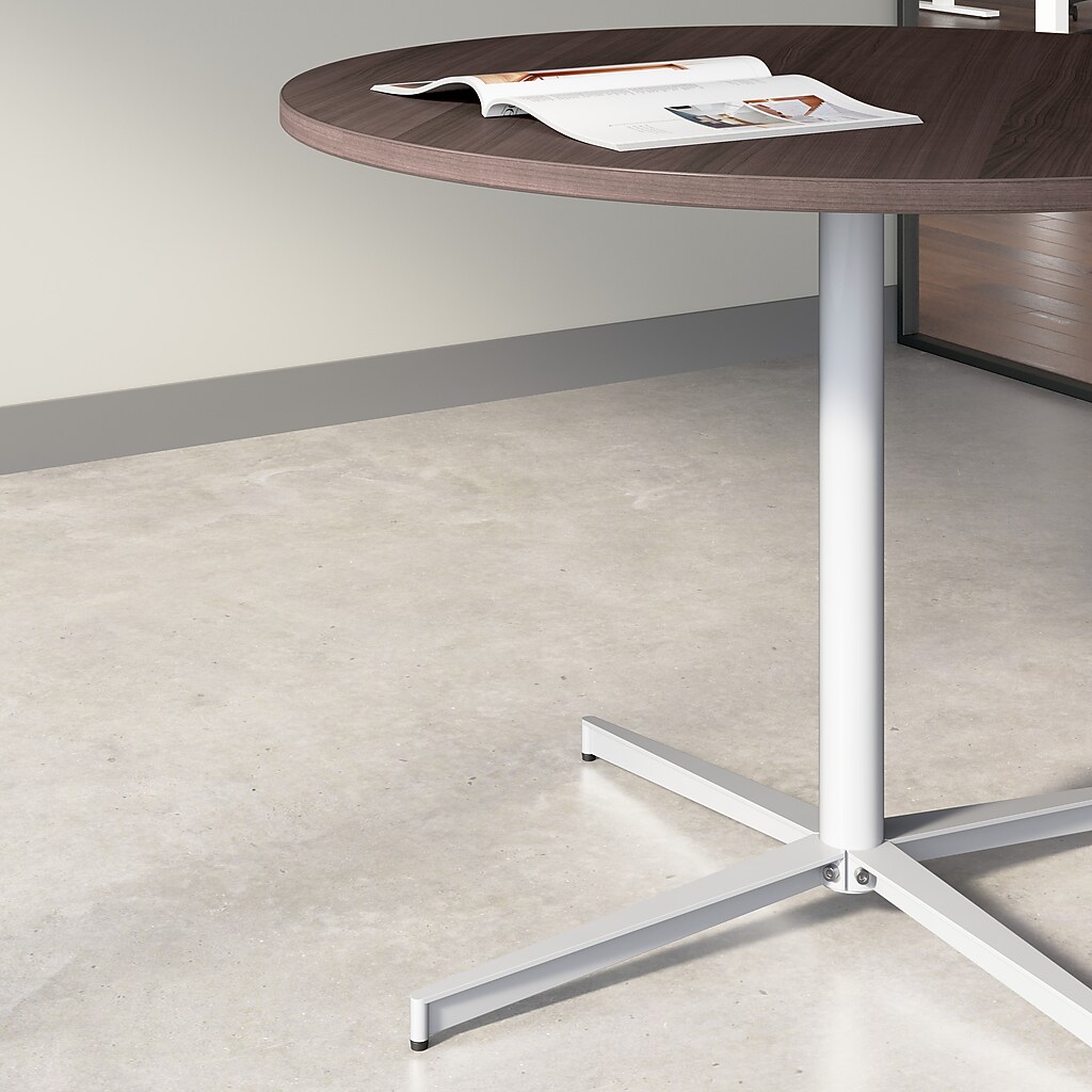 Close-up of table edge and pedestal at base