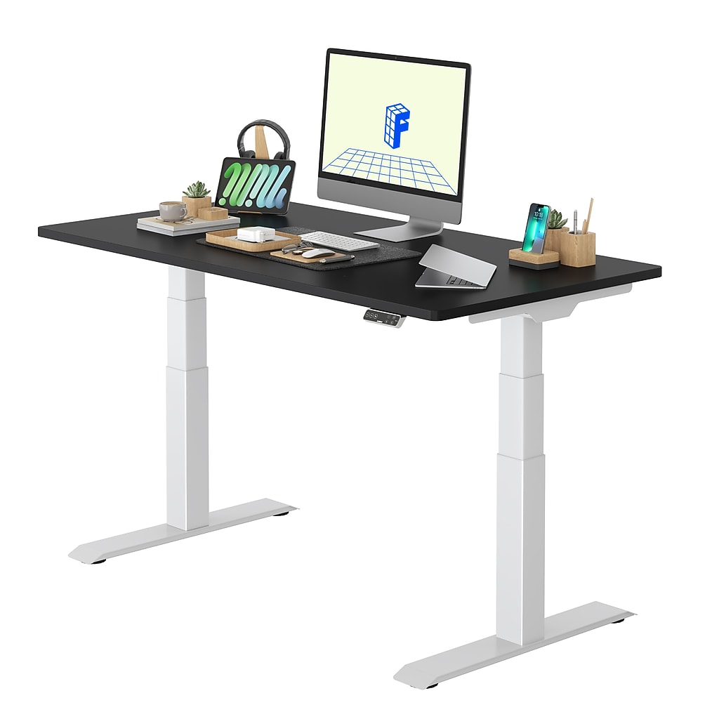Desk setup with computer and accessories on black top
