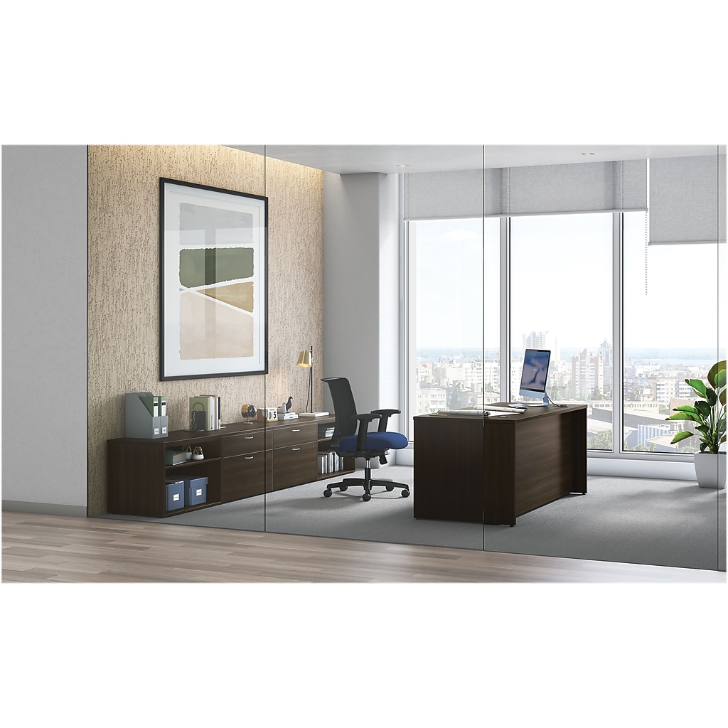Office desk set in a modern workspace with a matching desk and credenza against a glass wall.