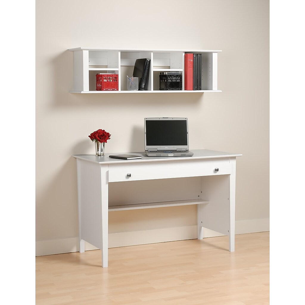 White desk with wall-mounted hutch above, laptop and flowers on desk