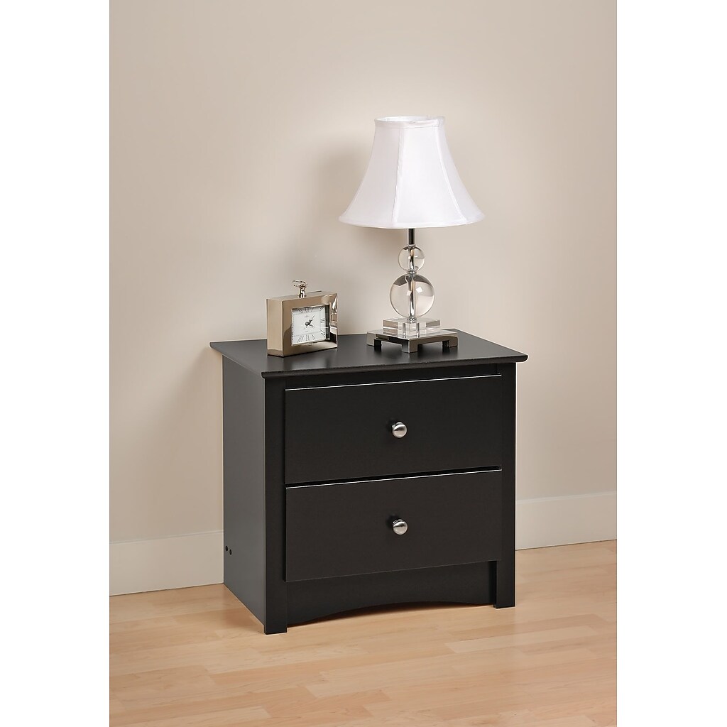 Nightstand with lamp and small decor on top
