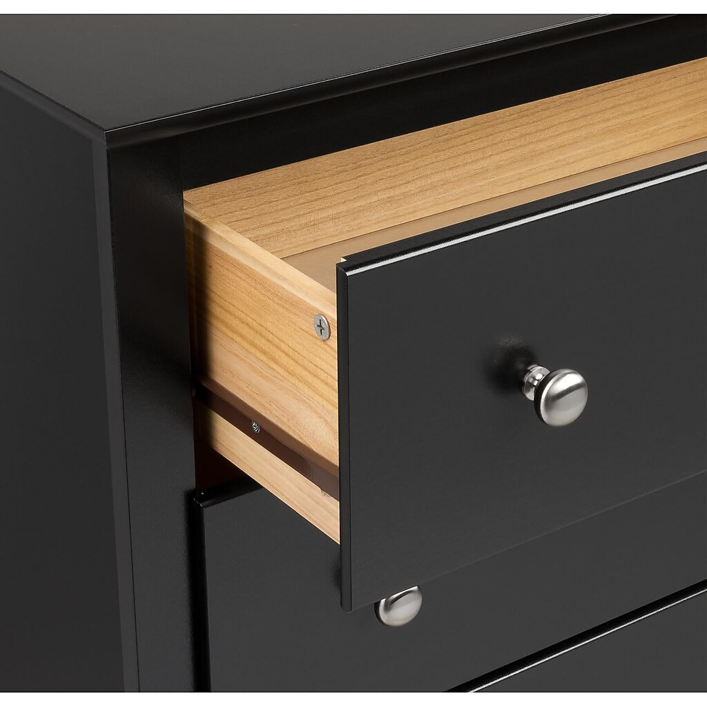 Close-up of open drawer showing light wood interior