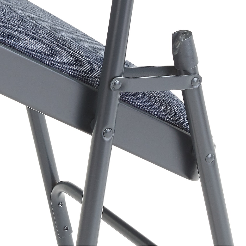 Close-up of chair joint and screw rivets at leg connection
