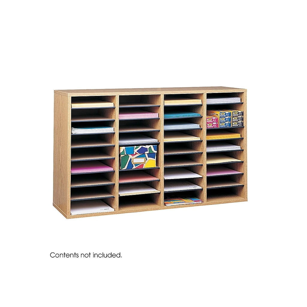 Wooden multi-compartment organizer with many slots filled with papers and colorful items.