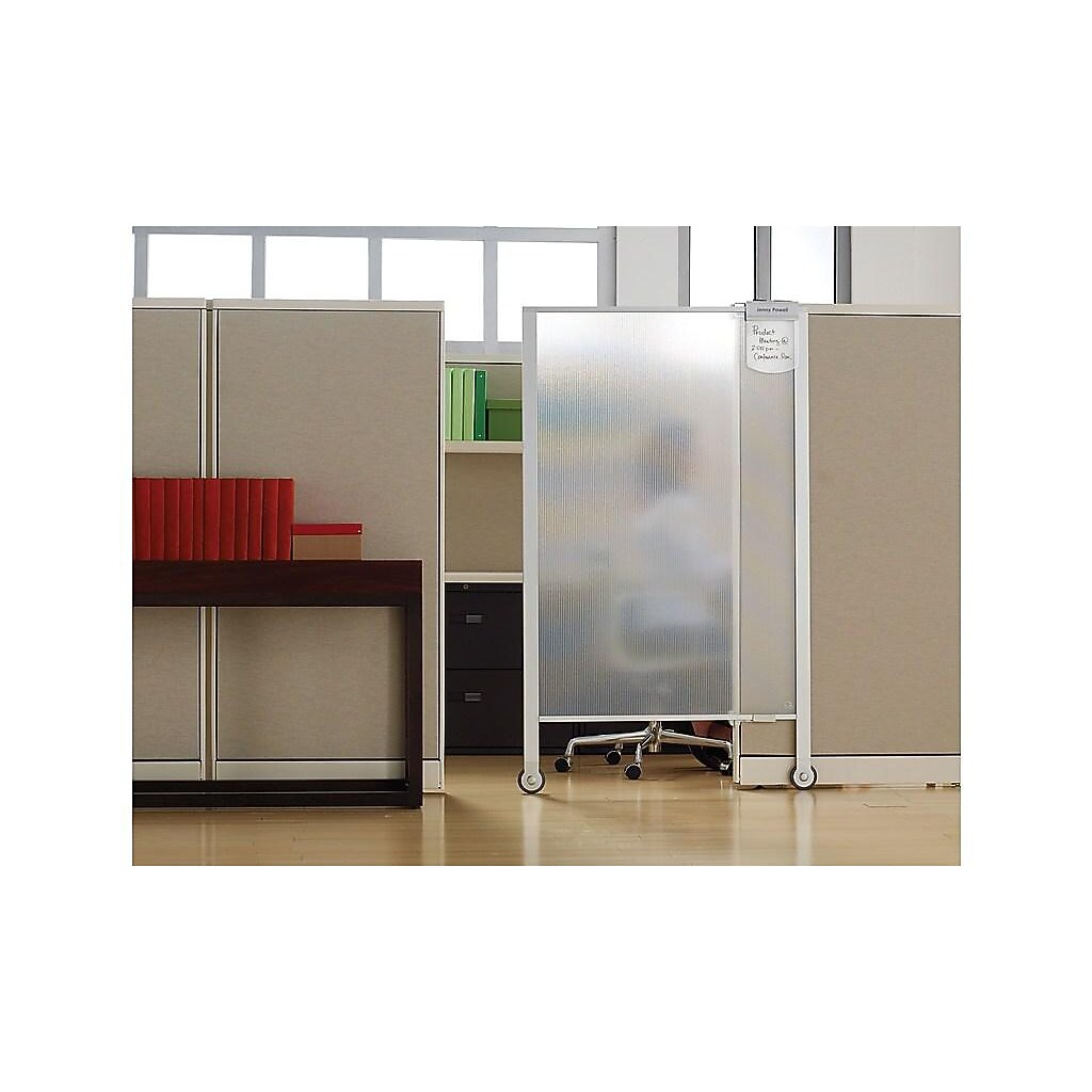 Privacy screen divider in an office with furniture