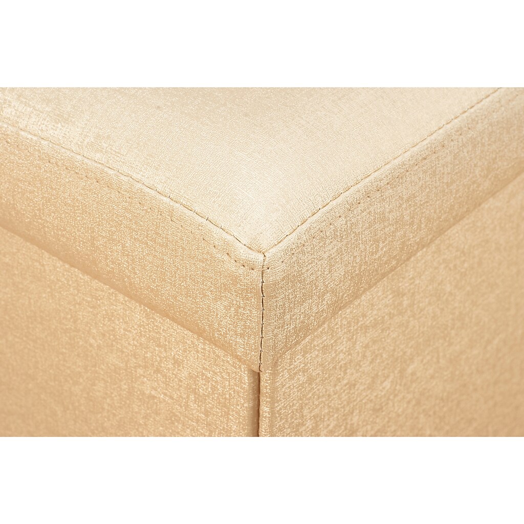 Corner seam detail of beige faux leather ottoman